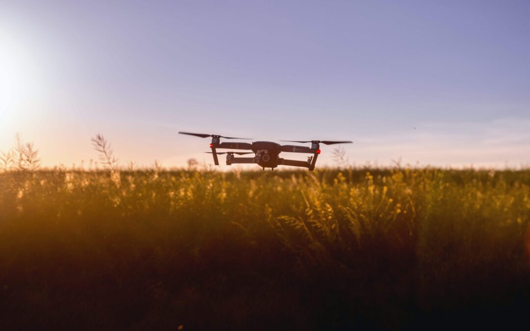 Drone hovering above open field at sunset during license training flight in Tennessee