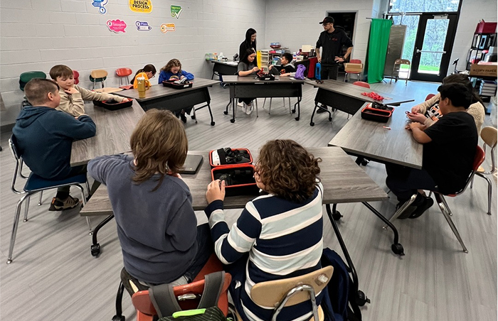 Students using Rocket Drones classroom STEM kits in a school setting designed for easy setup and smooth operation.