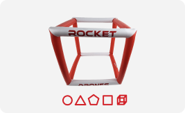 Rocket Drones inflatable obstacle gate with red and white frame and geometric shape icons for classroom drone training.